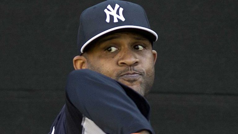 Yankees pitcher C.C. Sabathia throws in the bullpen at Steinbrenner Field on the morning of Tuesday, Feb. 18, 2014.