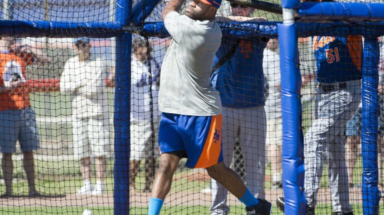 Eric Young takes on batting practice during spring training baseball practice, Monday, Feb. 17, 2014.