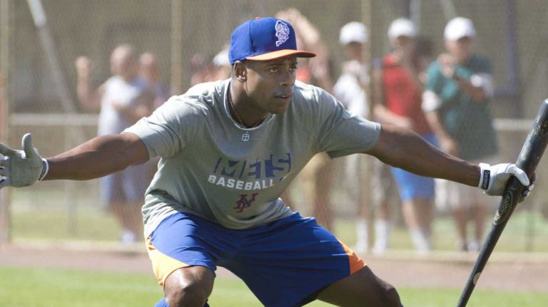 Curtis Granderson jokes during batting practice at spring training on Monday, Feb. 17, 2014.