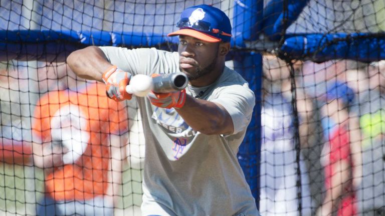 New York Mets' Eric Young takes on batting practice during spring training on Feb. 18, 2014, in Port St. Lucie, Fla.