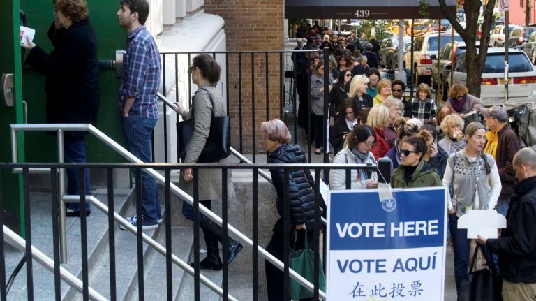 Voters wait in a long line on East 88th Street to cast their ballots at Yorkville Community School in Manhattan on Nov. 8, 2016.