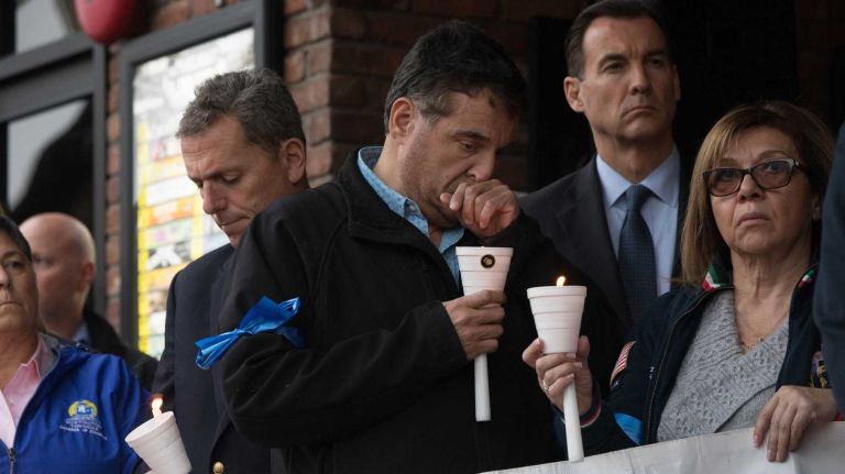 Bronx police shooting: Photos from the scene and more 20 Local legislators attend a vigil for slain NYPD Sgt. Paul Tuozzolo outside The Paramount in Huntington on Nov. 5, 2016.