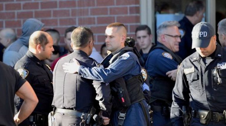 Bronx police shooting: Photos from the scene and more 36 Police officers gather outside the ambulance entrance of Jacobi Medical Center where two NYPD officers were taken with wounds Friday, Nov. 4, 2016, after a shootout that killed a suspect in the Van Nest neighborhood of the Bronx. One officer later died.