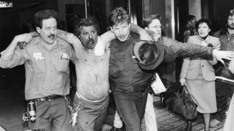 An injured man receives help at the scene of the deadly bombing at the World Trade Center on Feb. 26, 1993.