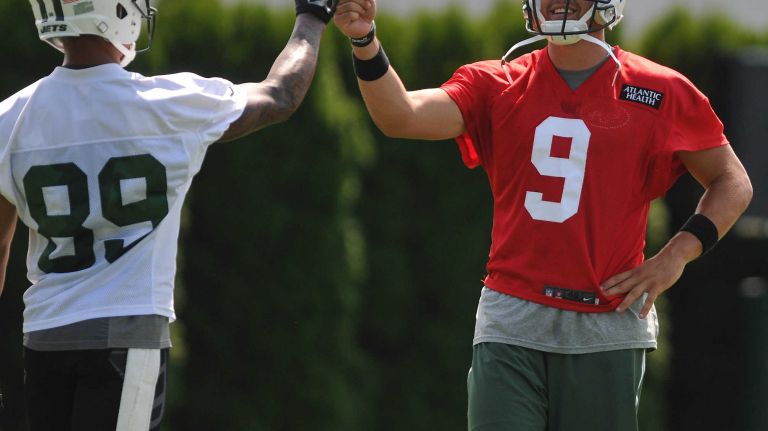 Bryce Petty #9, Quarterback, right, gives a fist bump to rookie Wide Receiver #89 Jalin Marshall during the first day of New York Jets team training camp at Atlantic Health Jets Training Center in Florham Park, NJ on Thursday, July 28, 2016.