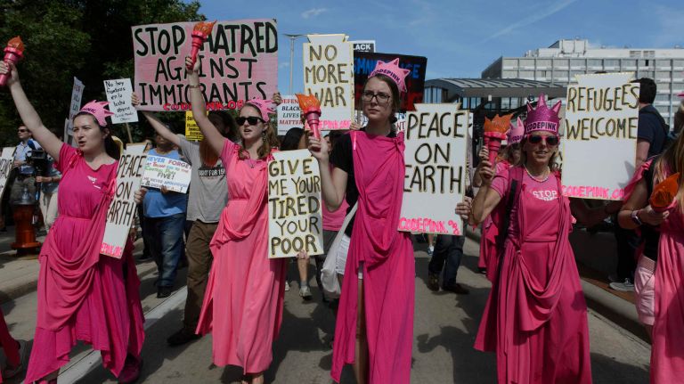 Anti-Trump protestors march through downtown Cleveland the day before the start of the Republican National Convention in Cleveland, Ohio, Sunday, July 17, 2016.