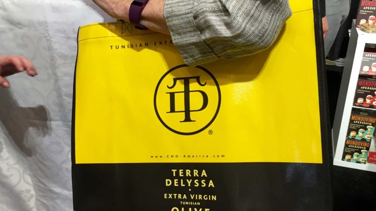Tote bags are the most popular giveaway at the show, since attendees are soon laden with promotional materials and samples. This year, the bag to have was the bold black-and-yellow tote given away by Terra Delyssa extra-virgin olive oil from Tunisia, the North African country that was the show