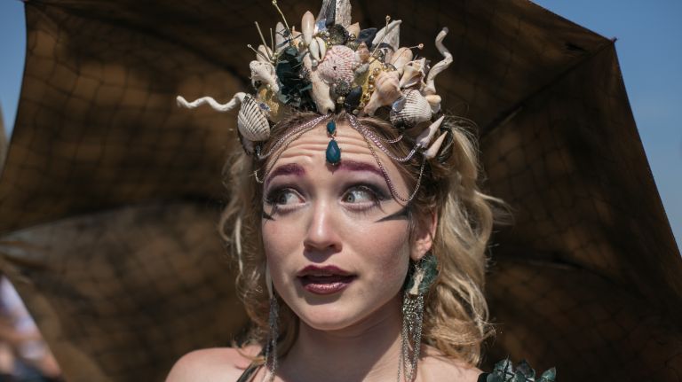 A parade participant makes a face for the camera.