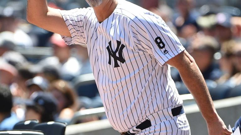 Former New York Yankees player Graeme Lloyd waves to fans during the 70th annual Old-Timers' Day at Yankee Stadium on Sunday, June 12, 2016.