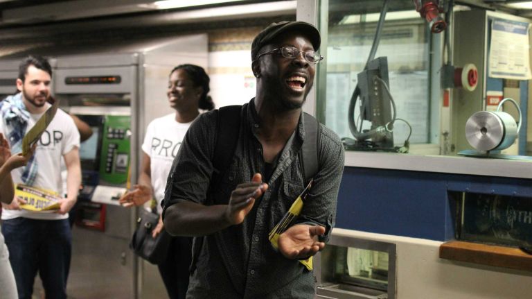 Free subway rides: See photos of protesters in Crown Heights 8 Benjamin Ndugga-Kabuye, of Black Alliance for Just Immigration, invites commuters to take advantage of a free MetroCard swipe at the Crown Heights-Utica Avenue subway station on Tuesday, June 7, 2016. Ndugga-Kabuye was one of about two dozen activists offering free subway rides as part of