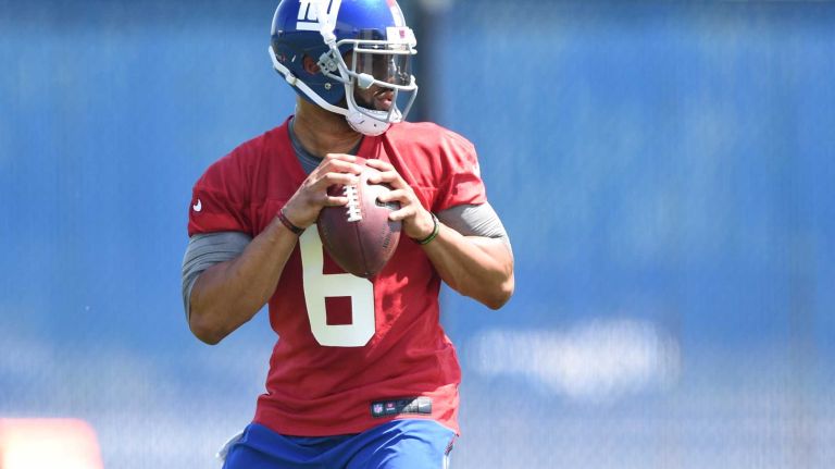 New York Giants quarterback B.J. Daniels looks to pass the football during the Giants Organized Team Activities at Quest Diagnostics Training Center on Monday, May 23, 2016.