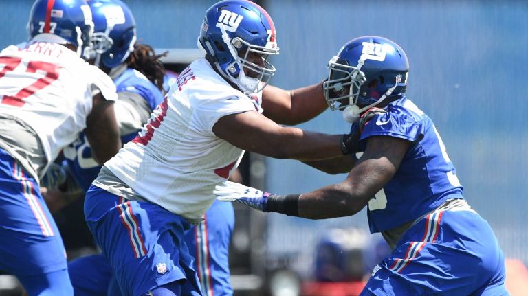 New York Giants offensive tackle Marshall Newhouse and Giants defensive end Jason Pierre-Paul participate in a play during the Giants Organized Team Activities at Quest Diagnostics Training Center on Monday, May 23, 2016.