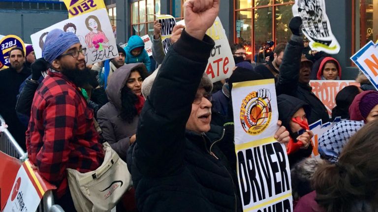 Uber CEO Travis Kalanick  stepped down from President Donald Trump's economic advisory council  amid protests. Above, a group of about 60 or so taxi drivers and immigrants from other work forces rallied outside Uber's  offices in Long Island City, Queens on Feb. 2, 2017. 