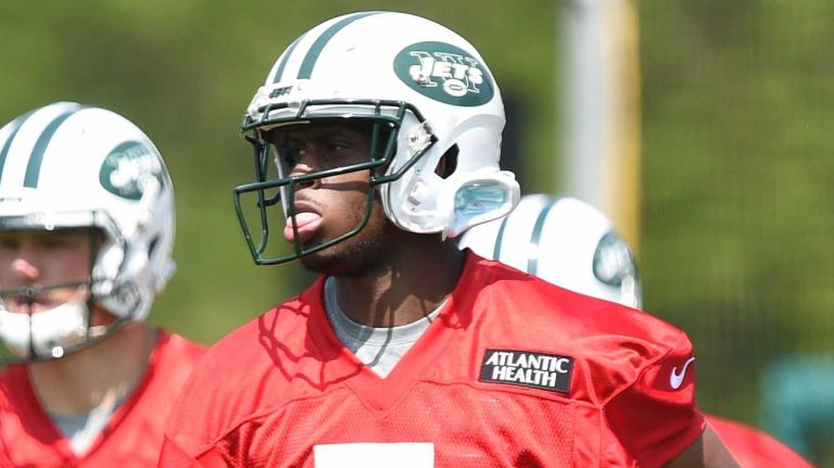 New York Jets quarterback Geno Smith heads to another section of the field during Organized Team Activities at the Jets Training Center on Wednesday, May 25, 2016.