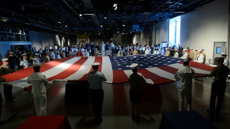 Fleet Week NYC: See photos of ships in New York Harbor and more 31 A Military Fag Detail unfurls an American flag during a Memorial Day ceremony aboard the Intrepid Sea, Air & Space Museum Complex in Manhattan, Monday, May 29, 2017.