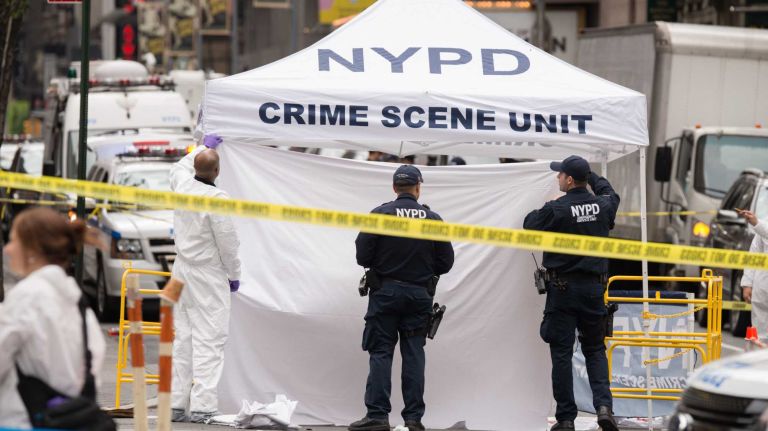 NYPD officers were on the scene of a cop-involved shooting on May 18, 2016. Police said that a knife-wielding man was fatally wounded by police after a confrontation outside of a midtown Food Emporium.