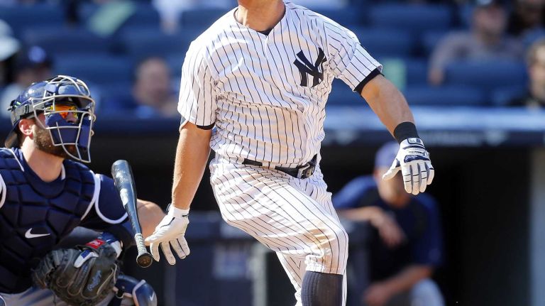 Yankees vs. Rays 85 Brett Gardner #11 of the New York Yankees follows through on his ninth inning game winning home run against the Tampa Bay Rays at Yankee Stadium on Saturday, April 23, 2016 in the Bronx Borough of New York City.