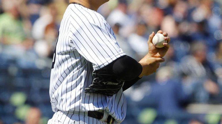 Yankees vs. Rays 98 Masahiro Tanaka #19 of the New York Yankees rubs up a new ball after surrendering a fifth inning home run against the Kevin Kiermaier #39 of the Tampa Bay Rays at Yankee Stadium on Saturday, April 23, 2016 in the Bronx Borough of New York City.