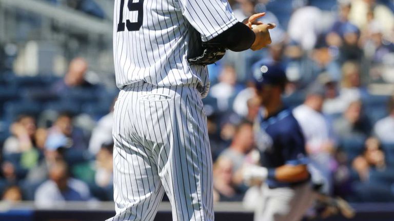 Yankees vs. Rays 99 Masahiro Tanaka #19 of the New York Yankees rubs up a new ball after surrendering a fifth inning home run against the Kevin Kiermaier #39 of the Tampa Bay Rays at Yankee Stadium on Saturday, April 23, 2016 in the Bronx Borough of New York City.