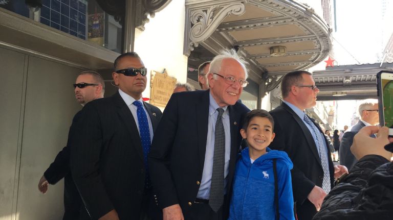 Bernie Sanders shook hands and took pictures with supporters outside Macy's in Herald Square before joining Verizon protesters on Seventh Avenue and 36th Street in Manhattan on April 18, 2016.