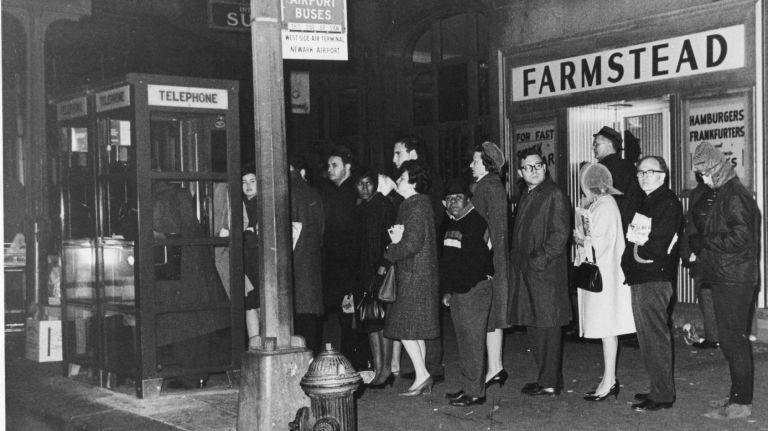 A line of people wait for the telephone in front of Grand Central Terminal during the blackout on Nov. 9, 1965.