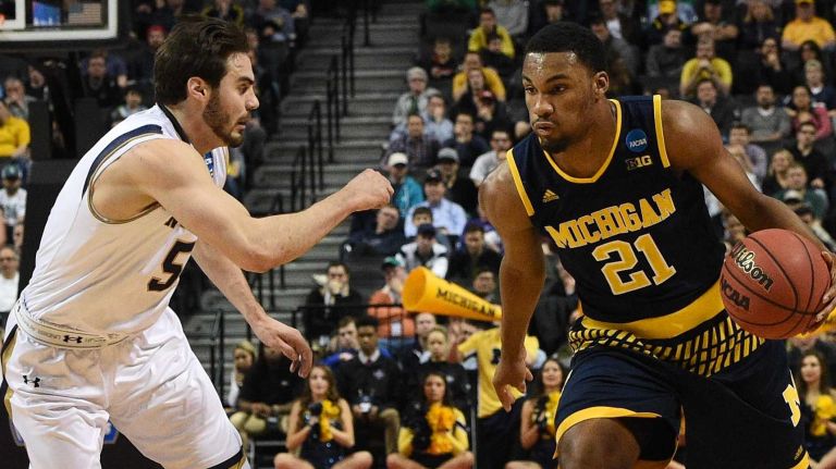 NCAA Tournament: Notre Dame vs. Michigan 19 Michigan Wolverines guard Zak Irvin drives the ball against Notre Dame Fighting Irish guard Matt Farrell during the first round of an East Regional men's basketball game in the NCAA Tournament at Barclays Center on Friday, March 18, 2016.