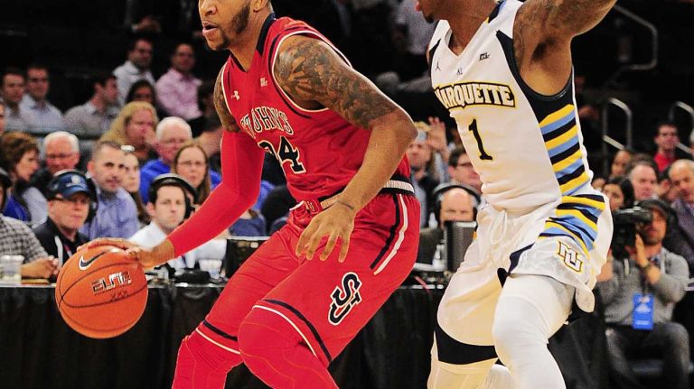 St. John's forward Ron Mvouika (24) is defended by Marquette guard Duane Wilson (1) during the Big East Tournament at Madison Square Garden in New York, New York on Wednesday, Mar 9, 2016. Big East Basketball Tournament between #10 St. John's and #7 Marquette.