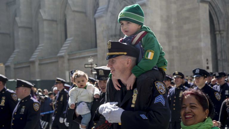 New York Police Department members march up Fifth Avenue during the St. Patrick's Day Parade in Manhattan on March 17, 2016.