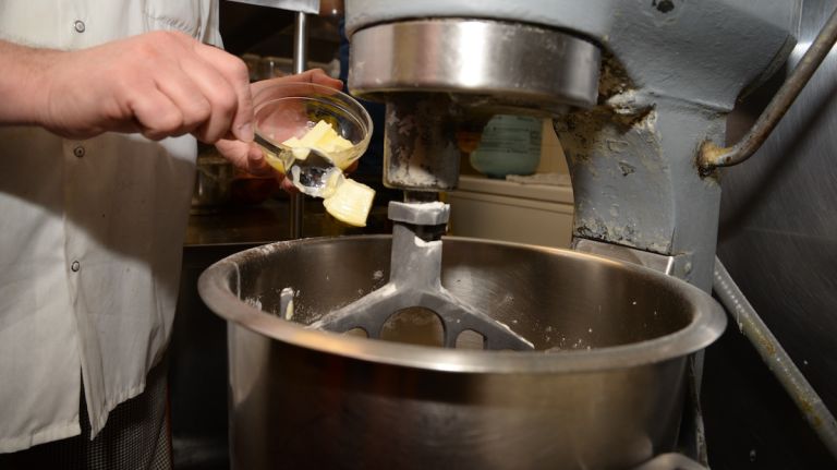 Add the butter 1 tablespoon at a time, waiting for each to be absorbed before adding another. Make sure butter is soft but not melted.