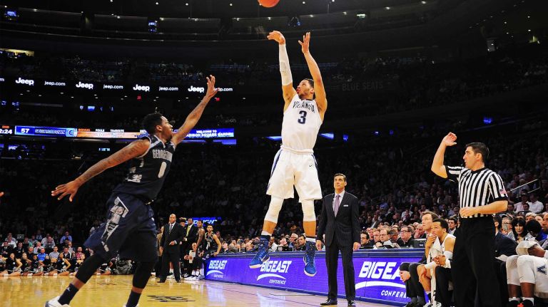 Villanova guard Josh Hart (3) hits a three point basket under pressure from Georgetown guard L.J. Peak (0) during the Big East Tournament at Madison Square Garden in New York, New York on Thursday, Mar 10, 2016. Big East Basketball Tournament between #8 Georgetown and #1 Villanova.