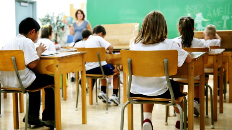 A teacher addressing a classroom.