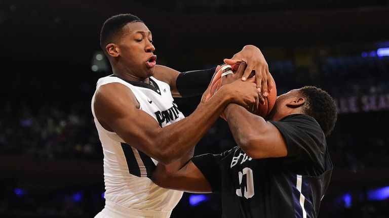 Providence guard Kris Dunn (3) is called for the foul on Butler forward Kelan Martin (30) during the Big East Tournament at Madison Square Garden in New York, New York on Thursday, Mar 10, 2016. Big East Basketball Tournament between #5 Butler and #4 Providence.