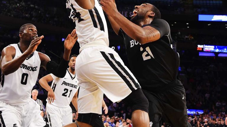 Butler forward Roosevelt Jones (21) drives to the basket defended by Providence guard Kyron Cartwright (24) during the Big East Tournament at Madison Square Garden in New York, New York on Thursday, Mar 10, 2016. Big East Basketball Tournament between #5 Butler and #4 Providence.