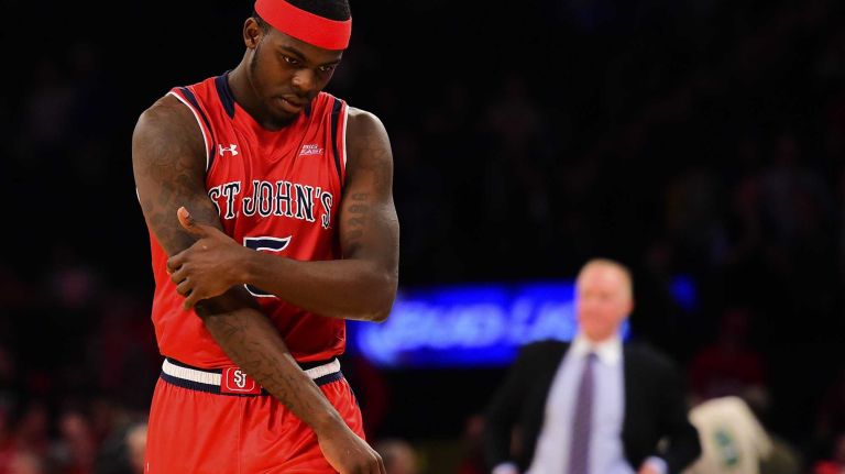 St. John's forward Durand Johnson (5) is dejected after his team is defeated by Marquette during the Big East Tournament at Madison Square Garden in New York, New York on Wednesday, Mar 9, 2016.