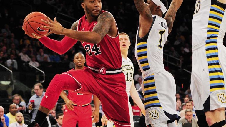 St. John's forward Ron Mvouika (24) is defended by Marquette guard Duane Wilson (1) during the Big East Tournament at Madison Square Garden in New York, New York on Wednesday, Mar 9, 2016. Big East Basketball Tournament between #10 St. John's and #7 Marquette.