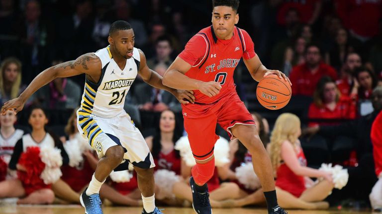 St. John's guard Malik Ellison (0) is defended by Marquette guard Traci Carter (21) during the Big East Tournament at Madison Square Garden in New York, New York on Wednesday, Mar 9, 2016. Big East Basketball Tournament between #10 St. John's and #7 Marquette.