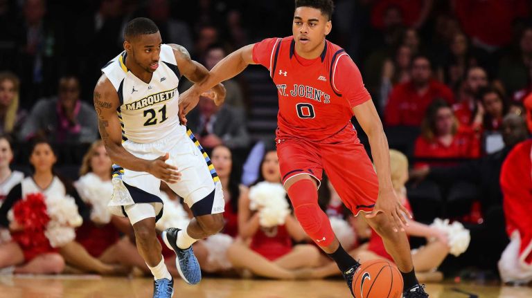 St. John's guard Malik Ellison (0) is defended by Marquette guard Traci Carter (21) during the Big East Tournament at Madison Square Garden in New York, New York on Wednesday, Mar 9, 2016. Big East Basketball Tournament between #10 St. John's and #7 Marquette.
