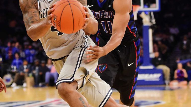 Georgetown guard D'Vauntes Smith-Rivera (4) is defended by DePaul guard Eli Cain (11) during the Big East Tournament at Madison Square Garden in New York, New York on Wednesday, Mar 9, 2016.