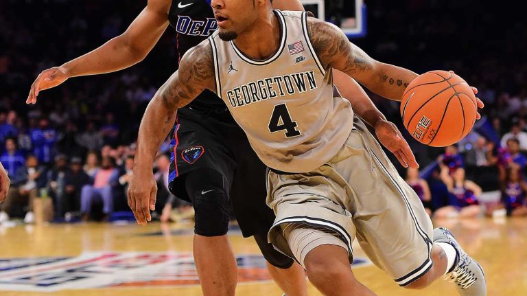 Georgetown guard D'Vauntes Smith-Rivera (4) is defended by DePaul guard Eli Cain (11) during the Big East Tournament at Madison Square Garden in New York, New York on Wednesday, Mar 9, 2016.