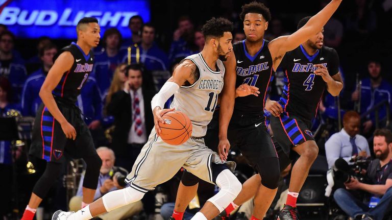 Georgetown forward Isaac Copeland (11) is defended by DePaul guard Eli Cain (11) during the Big East Tournament at Madison Square Garden in New York, New York on Wednesday, Mar 9, 2016.