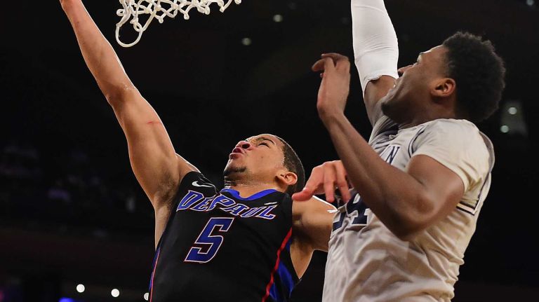 DePaul guard Billy Garrett Jr. (5) attempts a lay up under pressure from Georgetown forward Marcus Derrickson (24) during the Big East Tournament at Madison Square Garden in New York, New York on Wednesday, Mar 9, 2016.