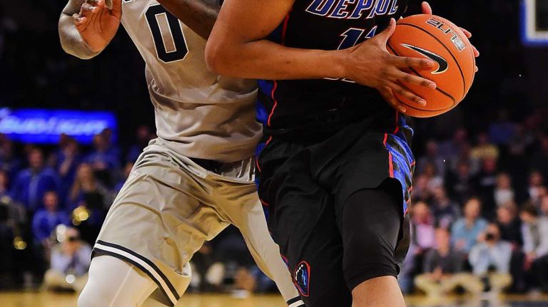 DePaul guard Eli Cain (11) drives to the basket defended by Georgetown guard L.J. Peak (0) during the Big East Tournament at Madison Square Garden in New York, New York on Wednesday, Mar 9, 2016.
