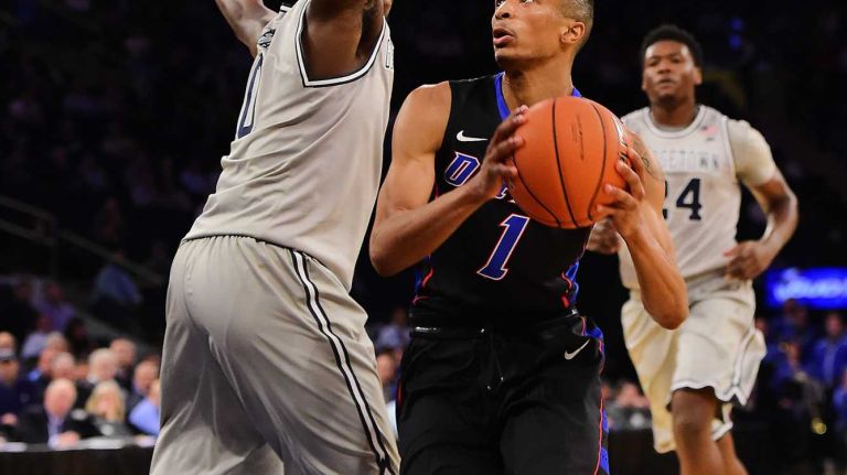 DePaul guard Darrick Wood (1) is defended by Georgetown guard L.J. Peak (0) during the Big East Tournament at Madison Square Garden in New York, New York on Wednesday, Mar 9, 2016.