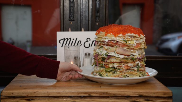 Each 70-layer blini cake is cut into slices, like pieces of pie. 