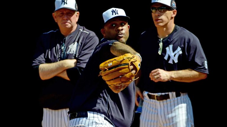 New York Yankees spring training 2016 145 New York Yankees C.C.Sabathia throws a bullpen session while being watched by Larry Rothschild and Joe Girardi during Spring Training at George M. Steinbrenner Field in Tampa Florida. Feb. 20, 2016
