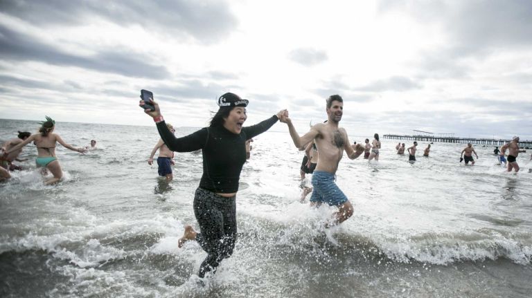 Despite the temperatures, swimmers enjoy the Coney Island Polar Bear Plunge in Brooklyn, on Jan. 1, 2016.