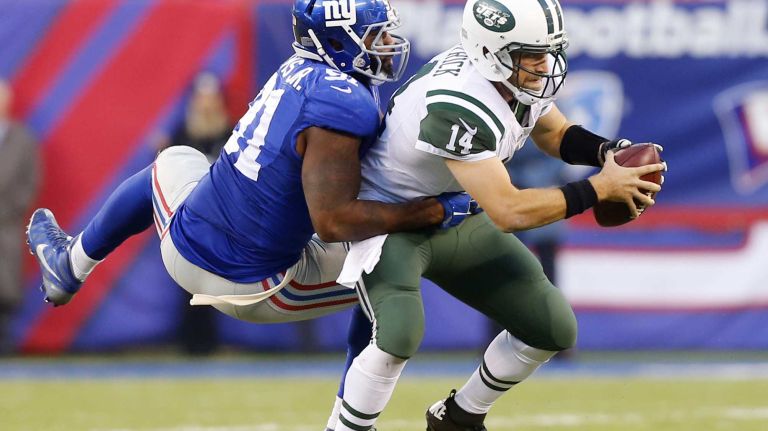 Robert Ayers #91 of the New York Giants sacks Ryan Fitzpatrick #14 of the New York Jets in the second half at MetLife Stadium on Sunday, Dec. 6, 2015 in East Rutherford, New Jersey.