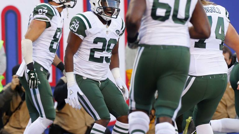 Bilal Powell #29 of the New York Jets celebrates his touchdown against the New York Giants with his teammates at MetLife Stadium on Sunday, Dec. 6, 2015 in East Rutherford, N.J.