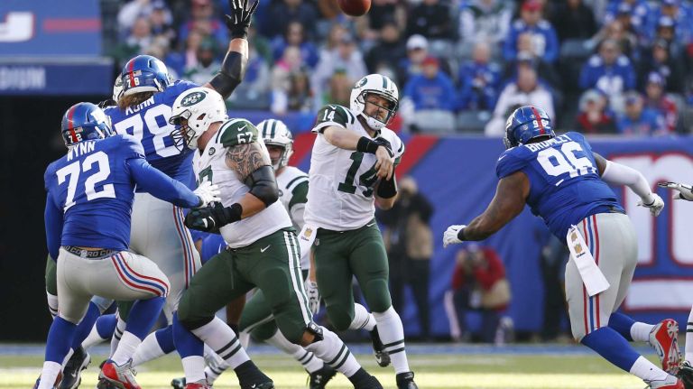 Ryan Fitzpatrick #14 of the New York Jets throws the ball against the New York Giants at MetLife Stadium on Sunday, Dec. 6, 2015 in East Rutherford, N.J.
