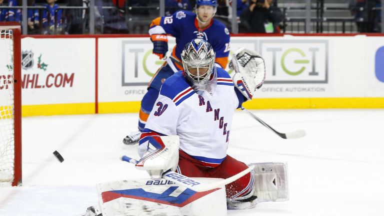 Henrik Lundqvist #30 of the New York Rangers makes a third period save against the New York Islanders at Barclays Center on Wednesday, Dec. 30, 2015 in Brooklyn, New York.